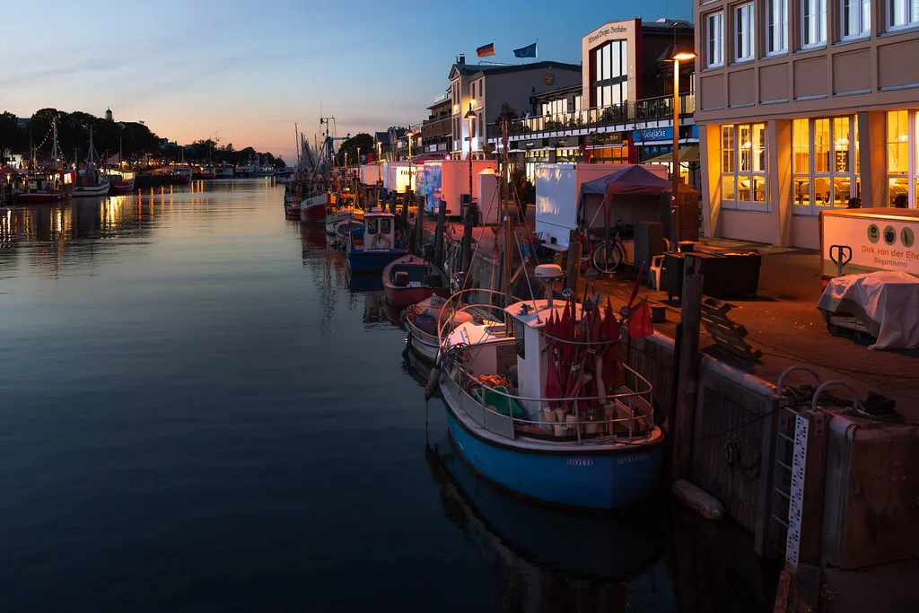 Warnemunde lighthouse and Baltic Sea beach with Strandkorb chairs at Rostock, Germany