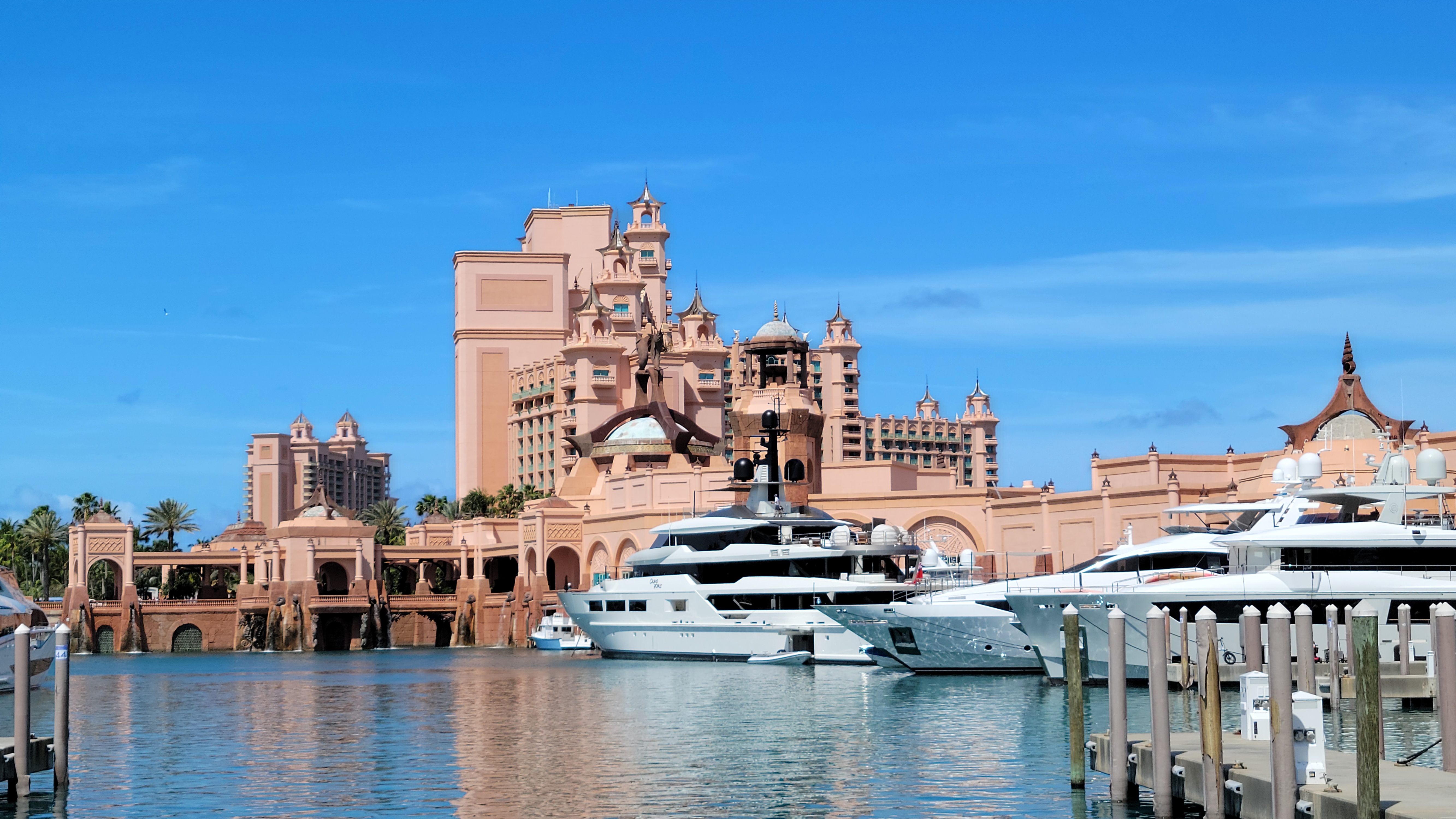 Row of overwater cabanas extending into turquoise Caribbean water