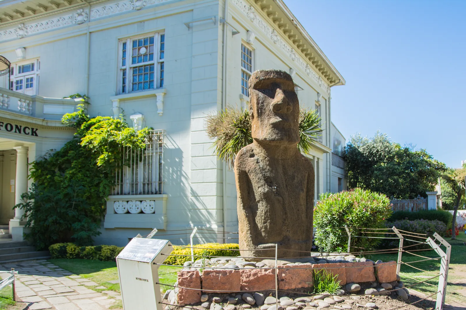An authentic Rapa Nui moai standing outside the Museo Fonck in Viña del Mar