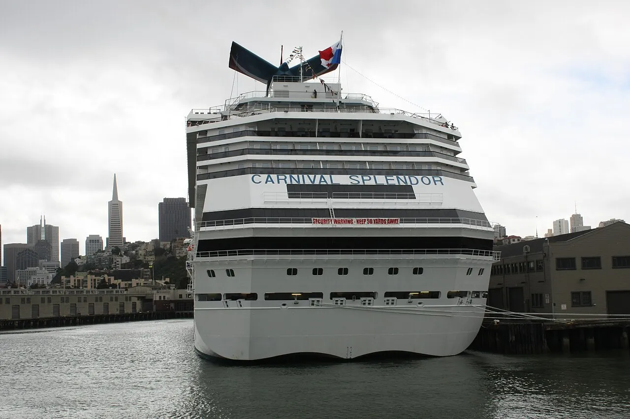 Carnival Splendor cruise ship bow-on in San Francisco Bay with Transamerica Pyramid in skyline