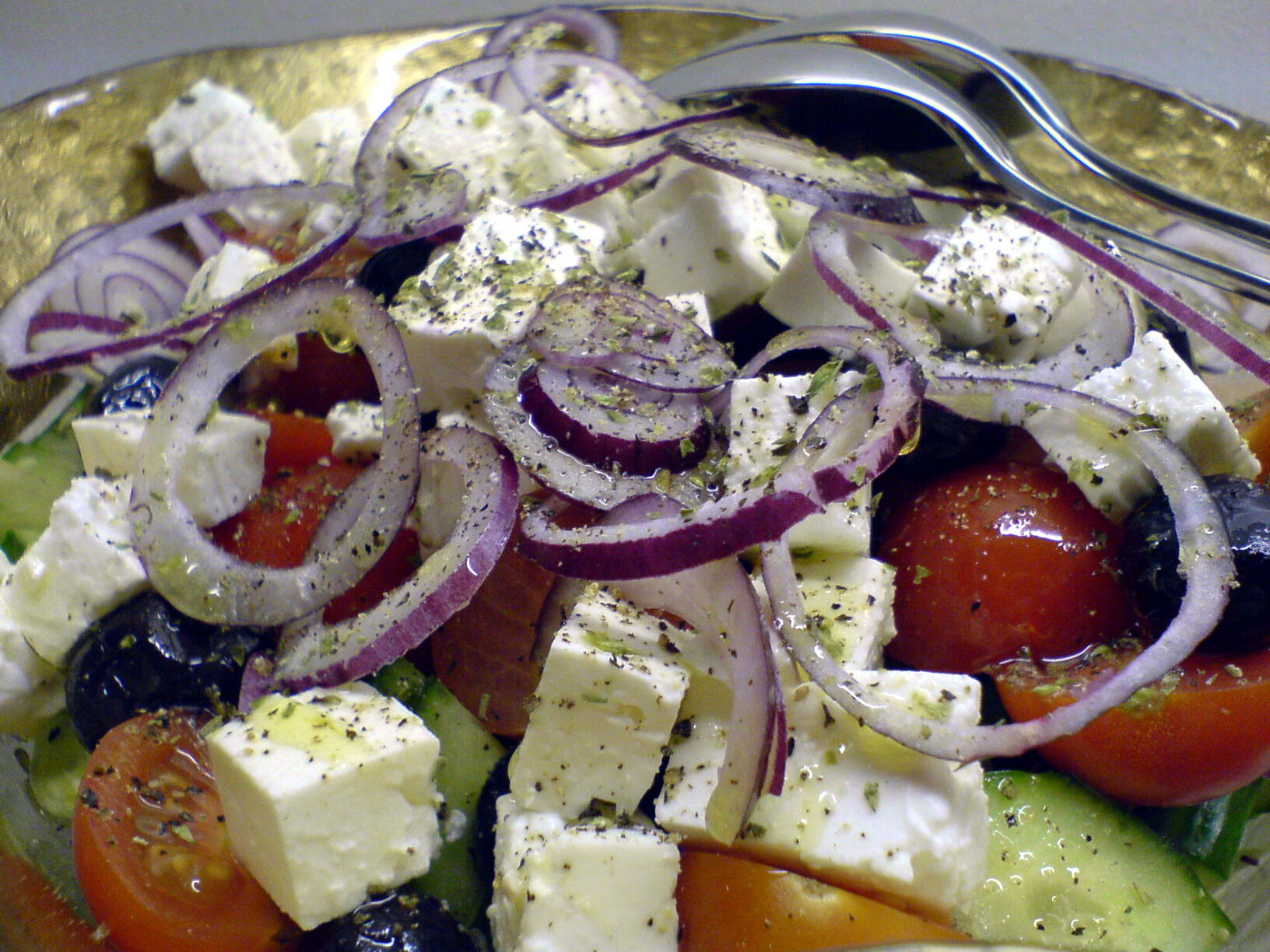 Classic Greek salad with feta cheese, tomatoes, olives, red onion, and olive oil