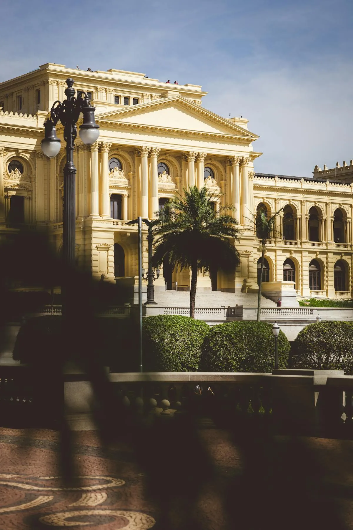 Ornate Belle Époque building facade with wrought-iron balconies and decorative stonework