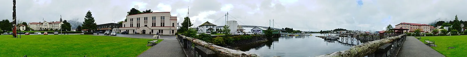 Panoramic view of Sitka showing Crescent Harbor, O'Connell Bridge, totem pole, and misty mountains