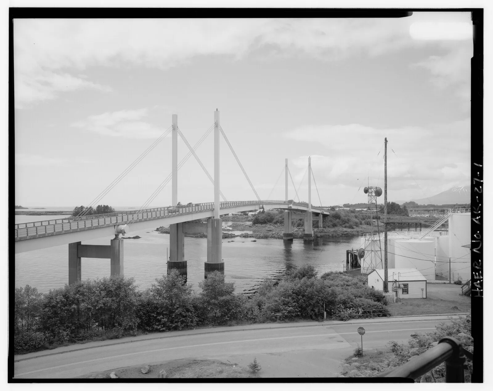 Historical HAER black and white photo of John O'Connell Bridge connecting Sitka to Japonski Island with mountains