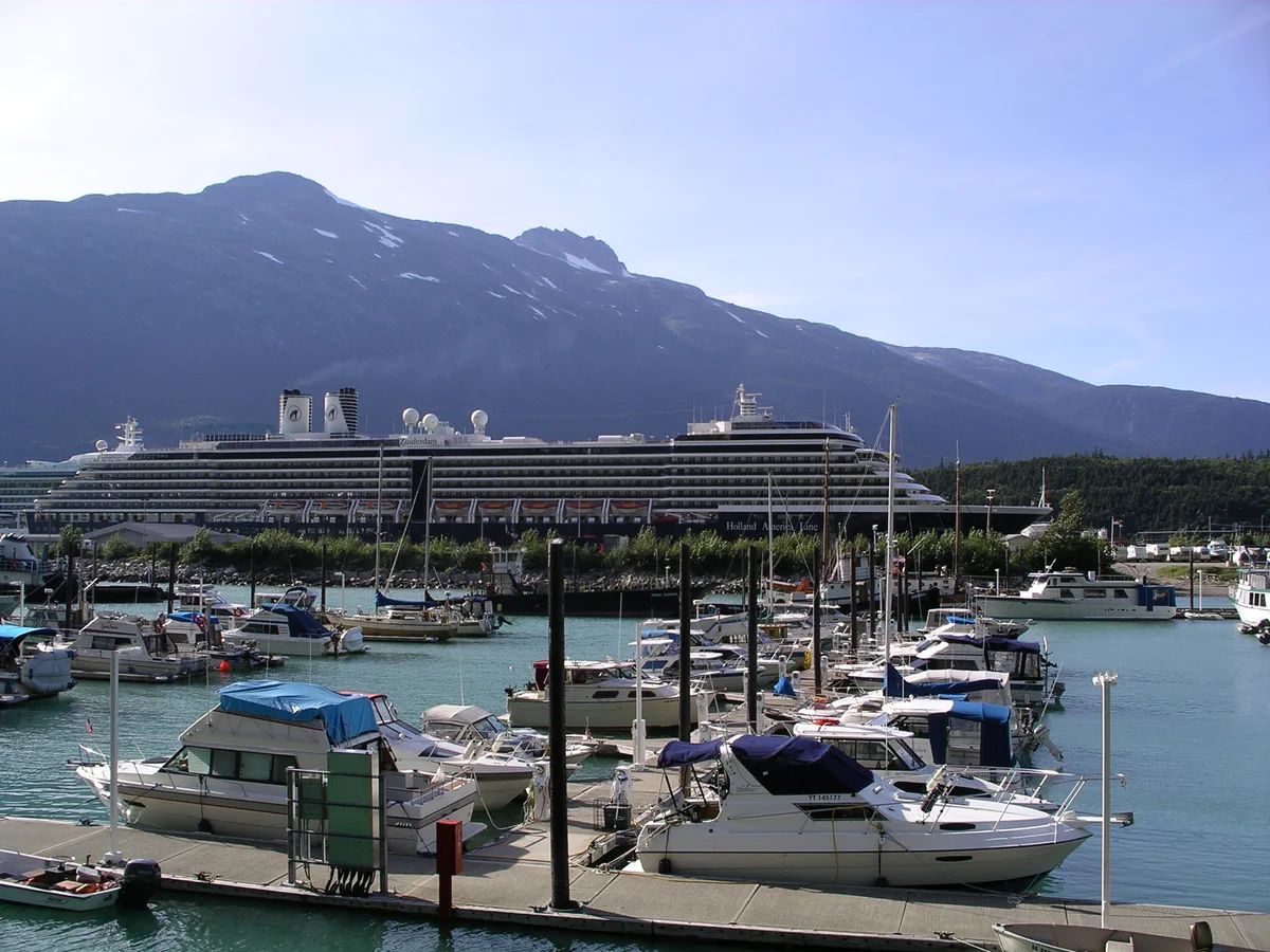 Skagway Alaska harbor with mountains rising behind the historic waterfront town