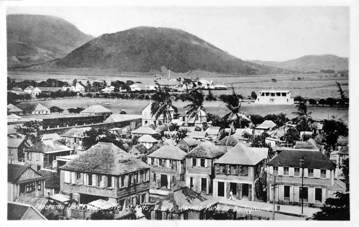 Historic postcard panorama of North Basseterre, St. Kitts with Warner Park in background