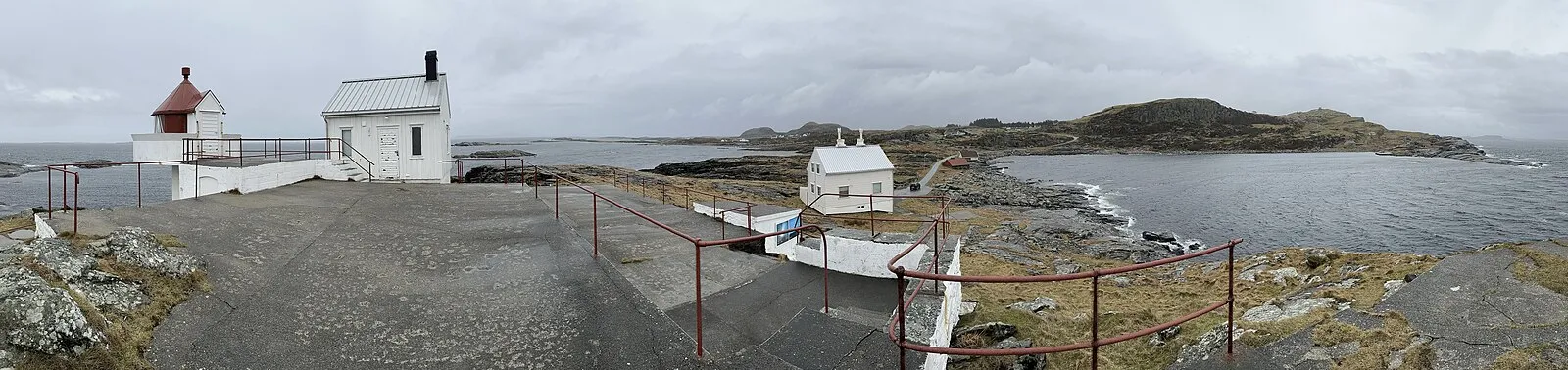 Dramatic Lysefjord cliff walls with waterfalls cascading into Norwegian waters