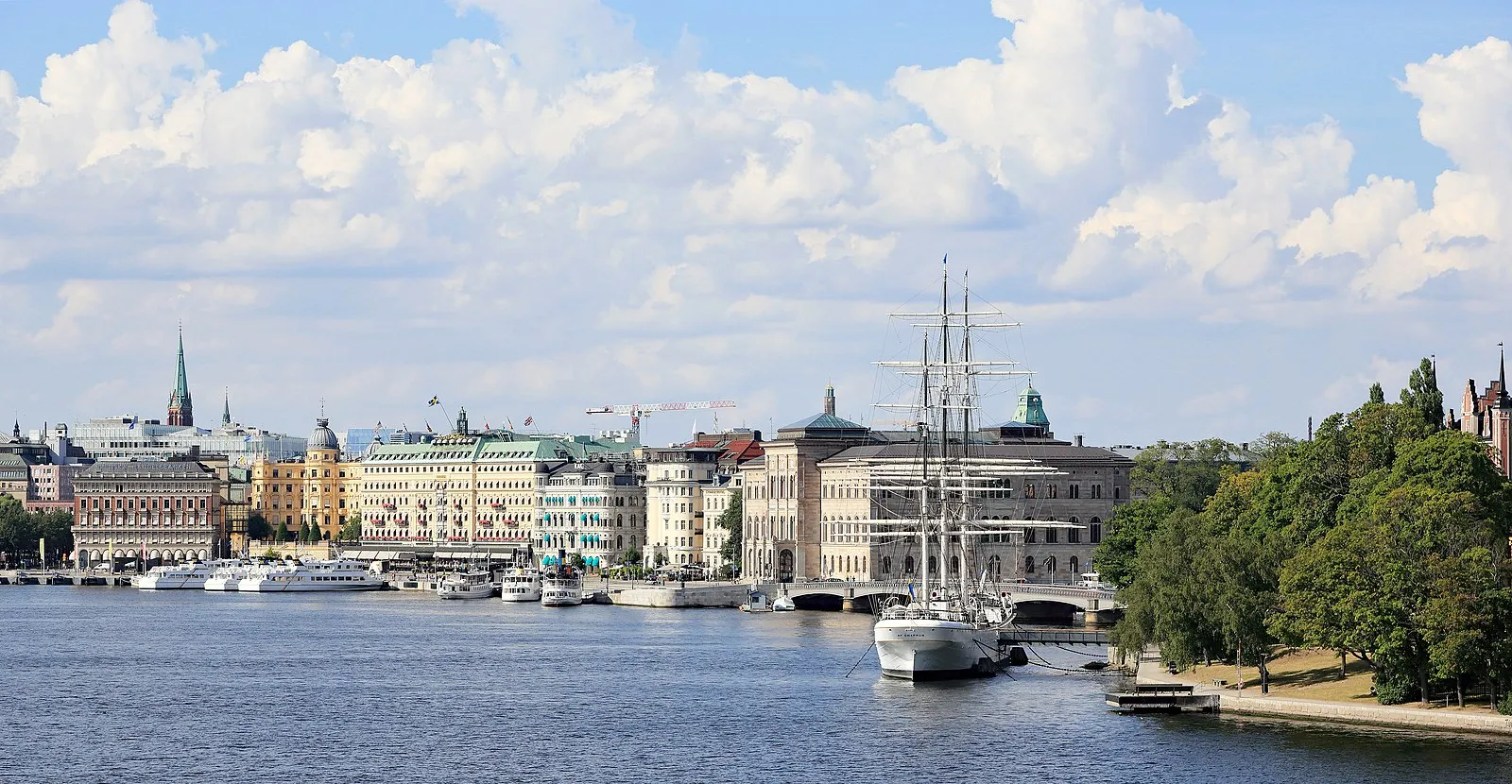 Stockholm waterfront panorama showing Strandvägen, Grand Hôtel, and tall ship af Chapman