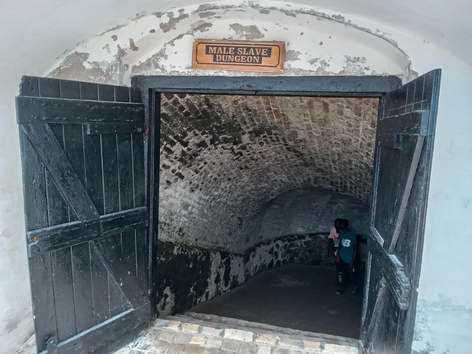 The male slave dungeon at Cape Coast Castle, a low vaulted stone chamber