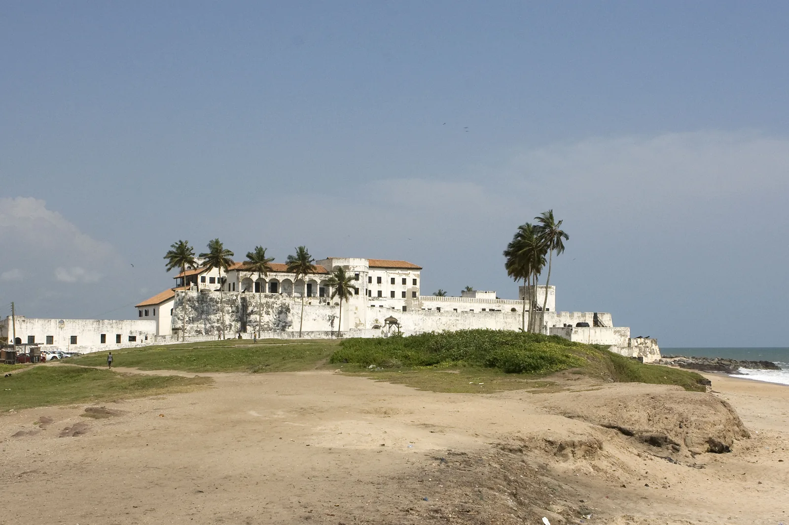 Elmina Castle in Ghana, the white fortress of St George of the Mine seen from across the water