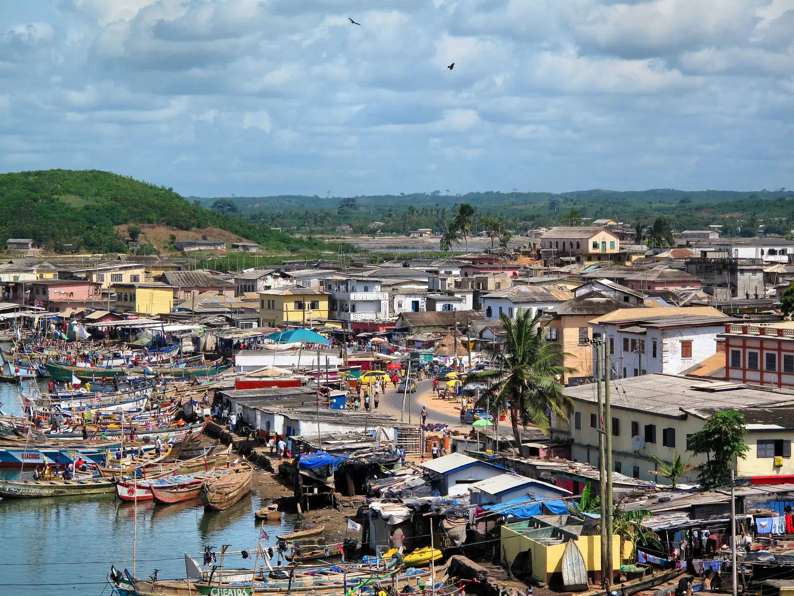 The fishing wharves at Elmina, packed with brightly painted wooden canoes
