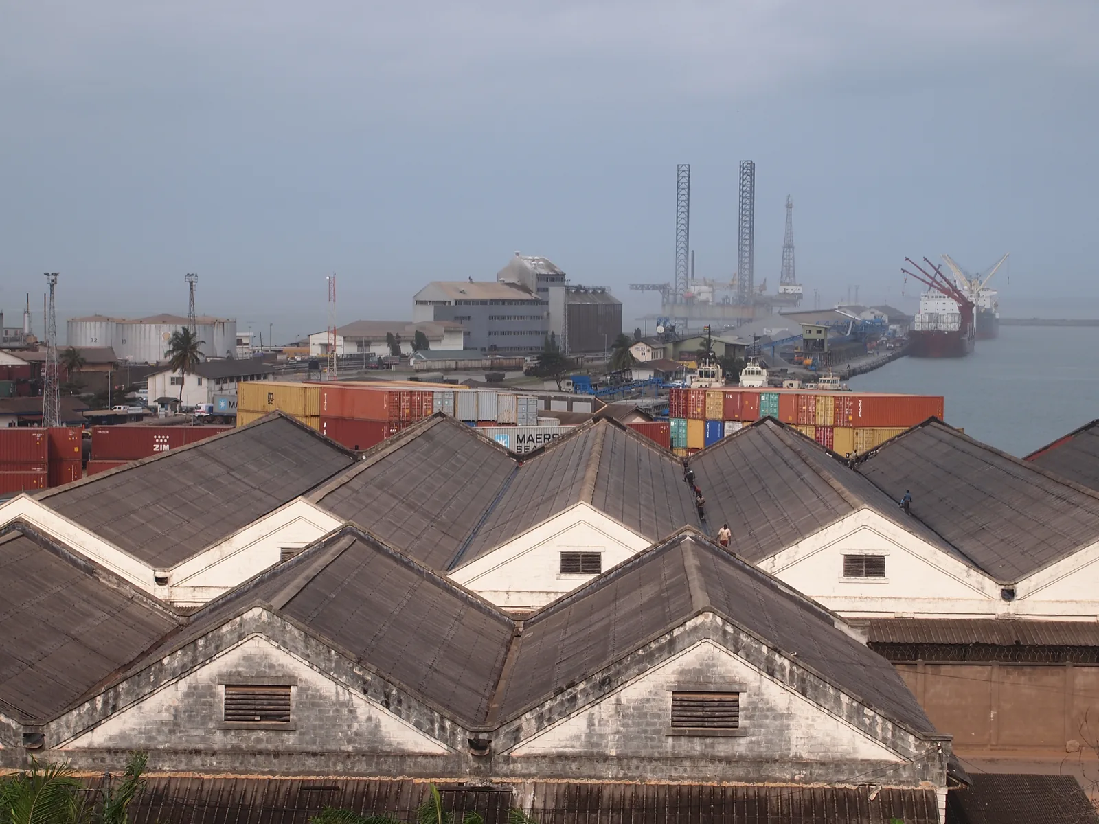 Takoradi Harbour in Ghana, cargo quays and vessels seen across the water