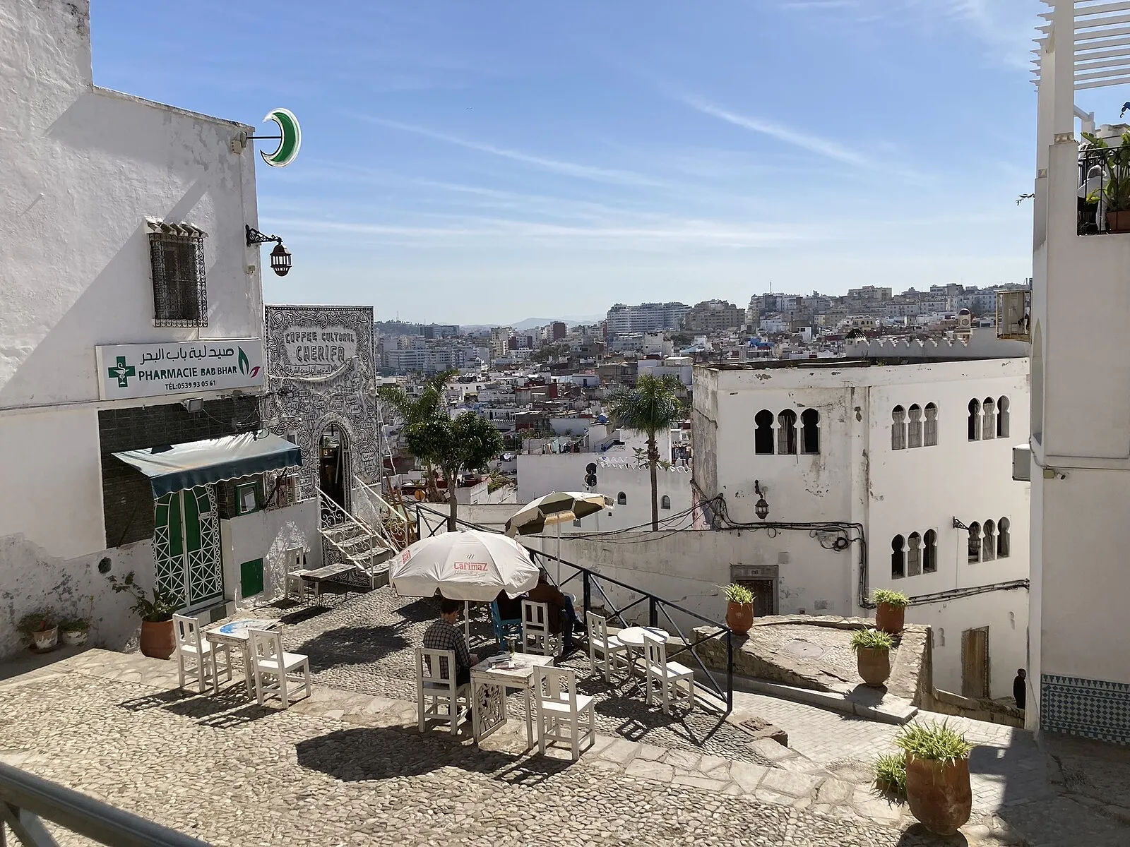 Tangier medina rooftop cafe terrace with Pharmacie Bab Bhar and panoramic city view