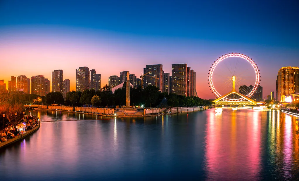 Sweeping panoramic view of Tianjin skyline with the Hai River winding through the city