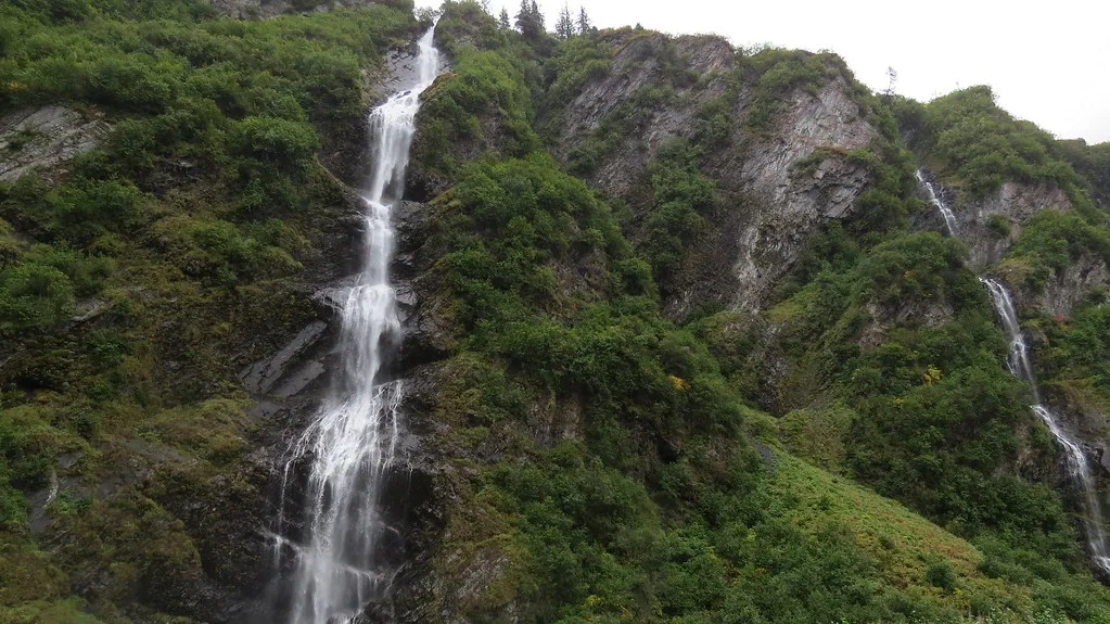 Waterfall cascading down rock walls in Keystone Canyon near Valdez