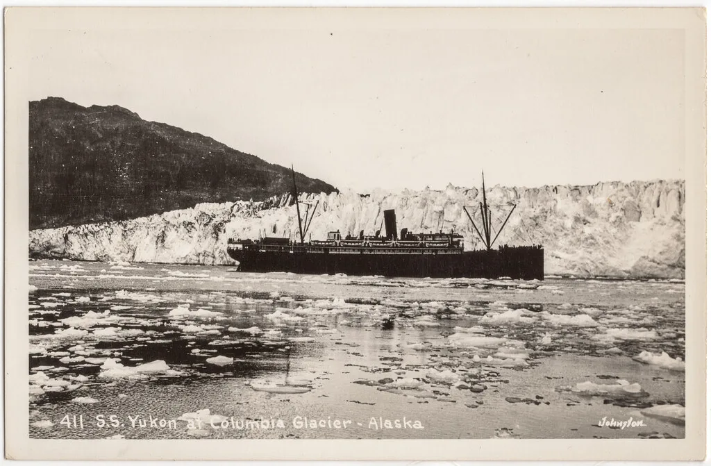 Ship near Columbia Glacier with icebergs floating in Prince William Sound