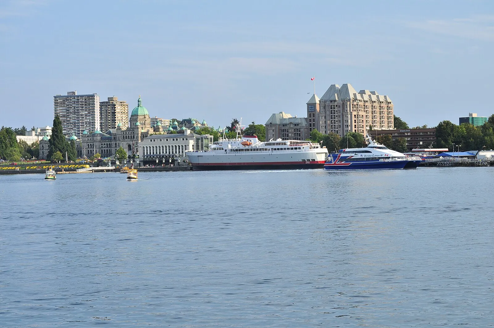 Victoria Inner Harbour with Victoria Clipper IV catamaran, ferries, and The Fairmont Empress