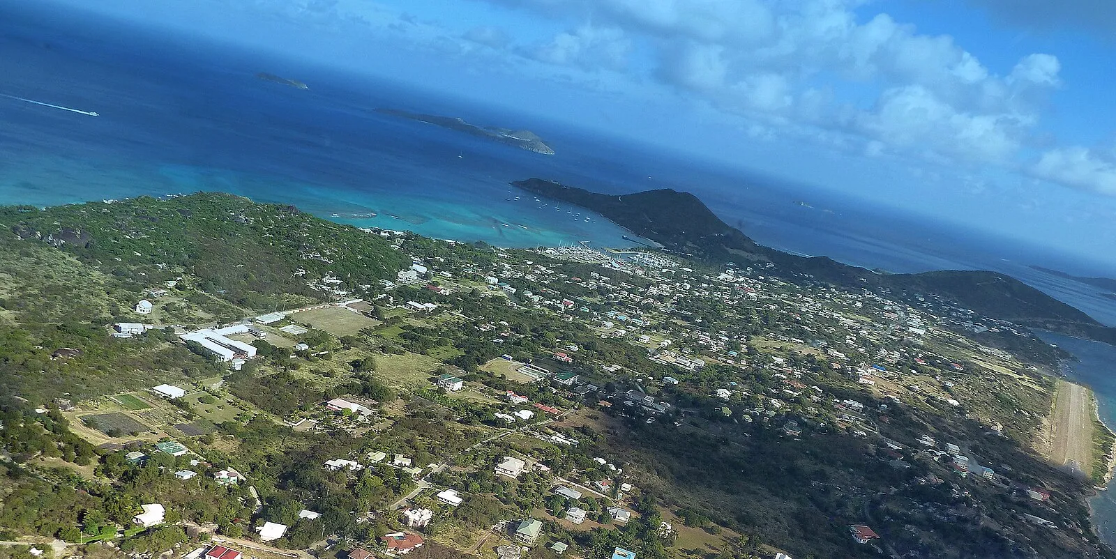 Spring Bay beach with granite boulders framing pristine white sand and calm turquoise waters on Virgin Gorda