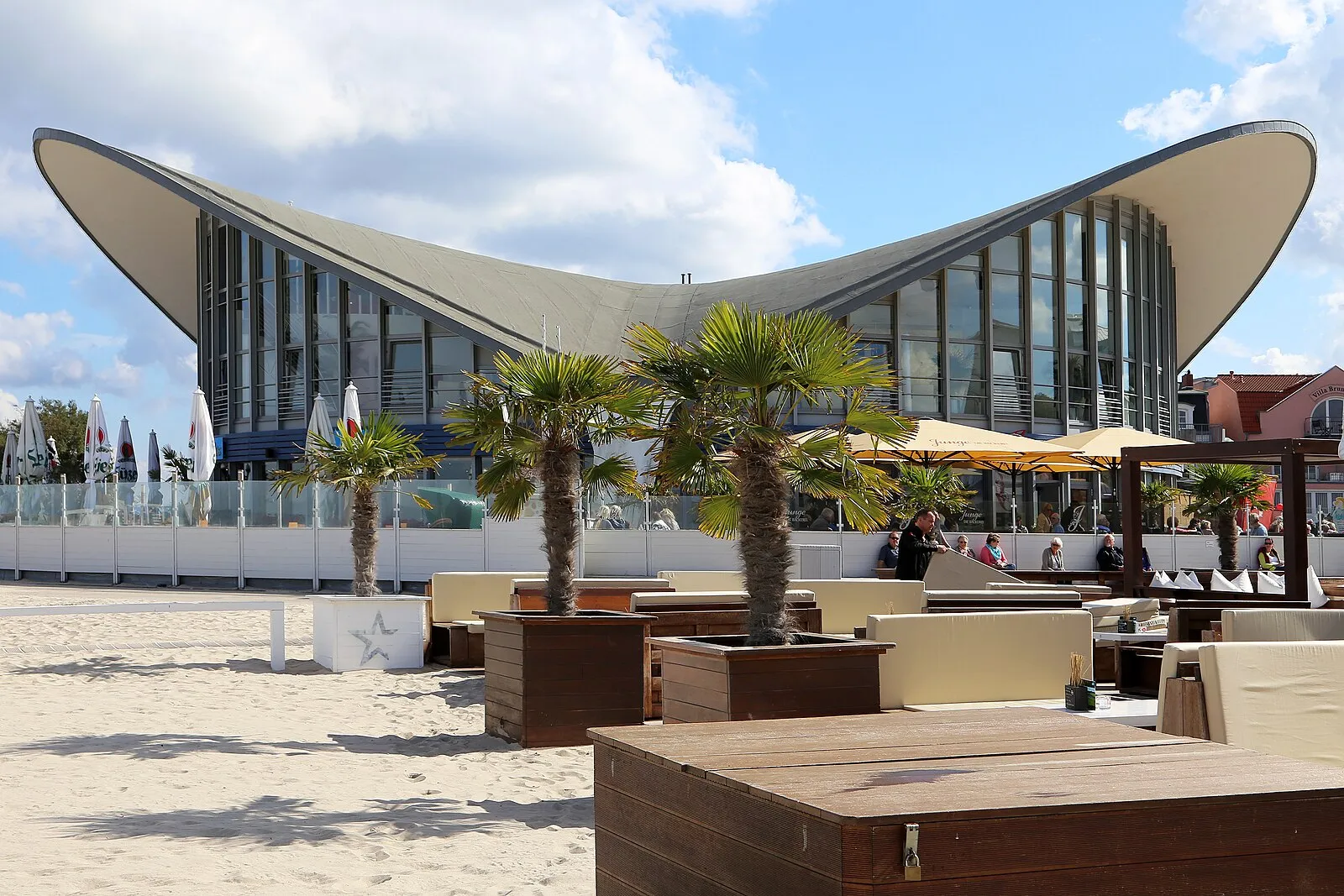 Warnemünde Teepott restaurant building with distinctive hyperbolic paraboloid roof and beach terrace