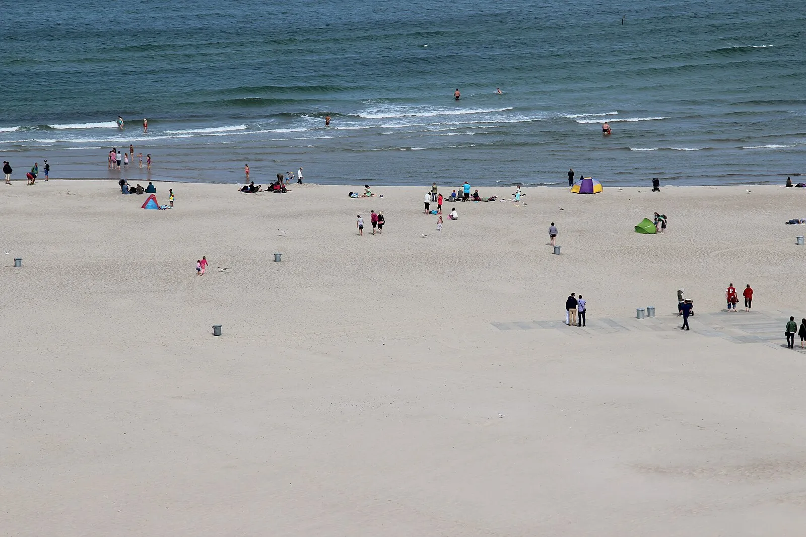 Warnemünde beach from above with beachgoers and Baltic Sea swimmers