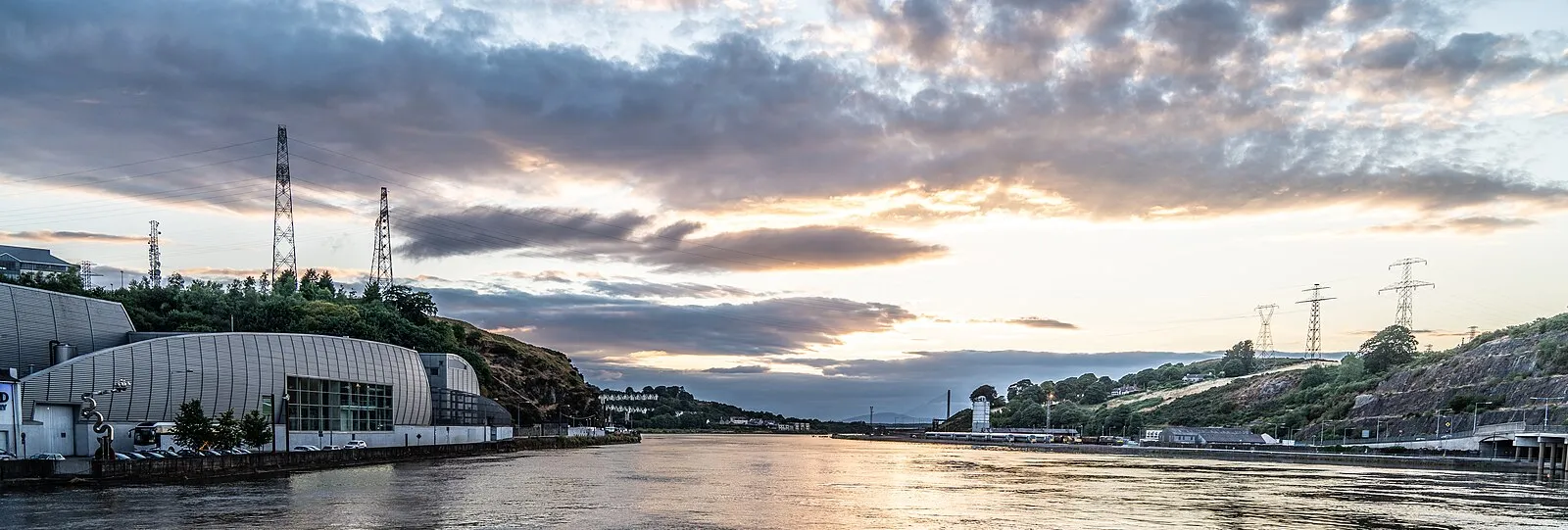 Sunset panorama over the River Suir in Waterford with modern waterfront buildings