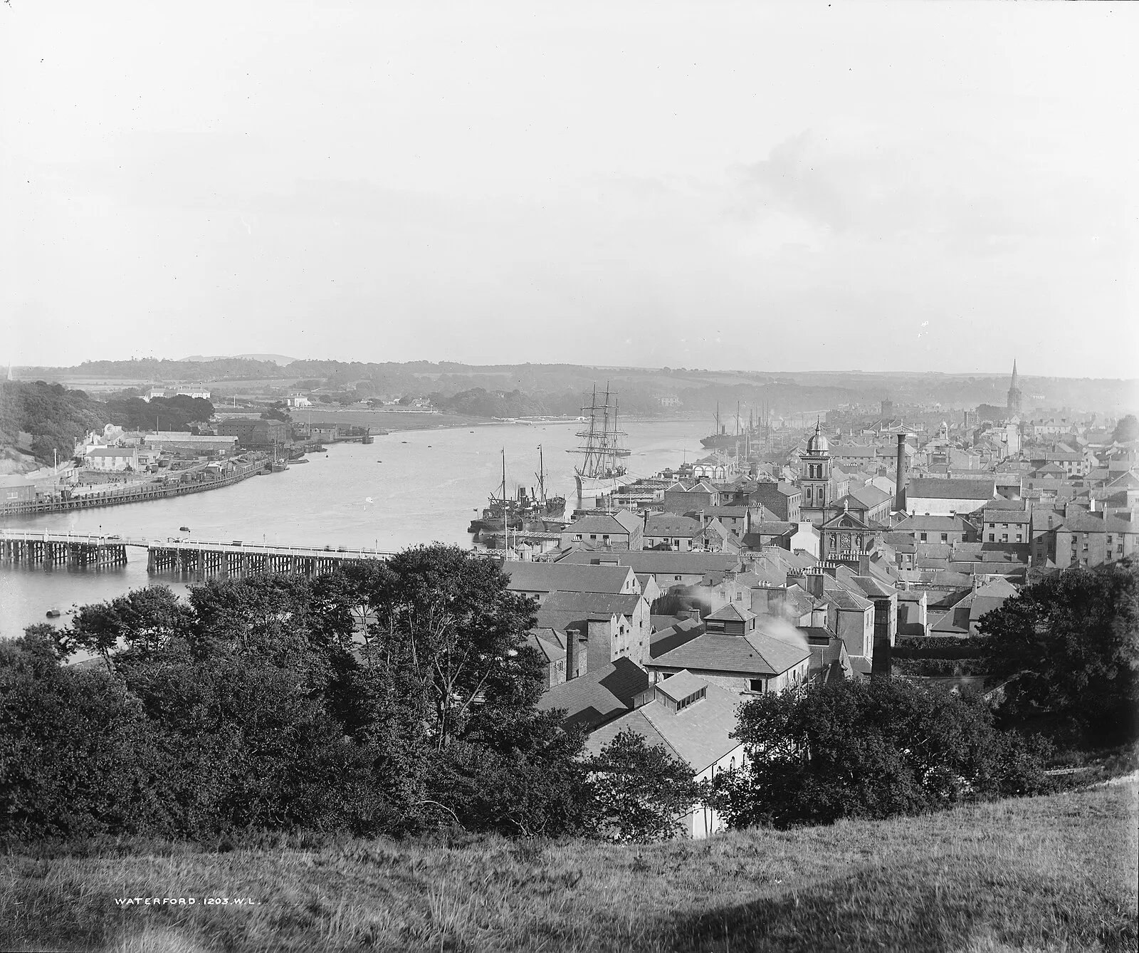 Historic black and white photograph of Waterford city and River Suir with sailing ships, c.1900