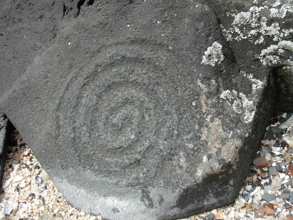 Ancient rock carvings on beach boulders at Petroglyph Beach in Wrangell