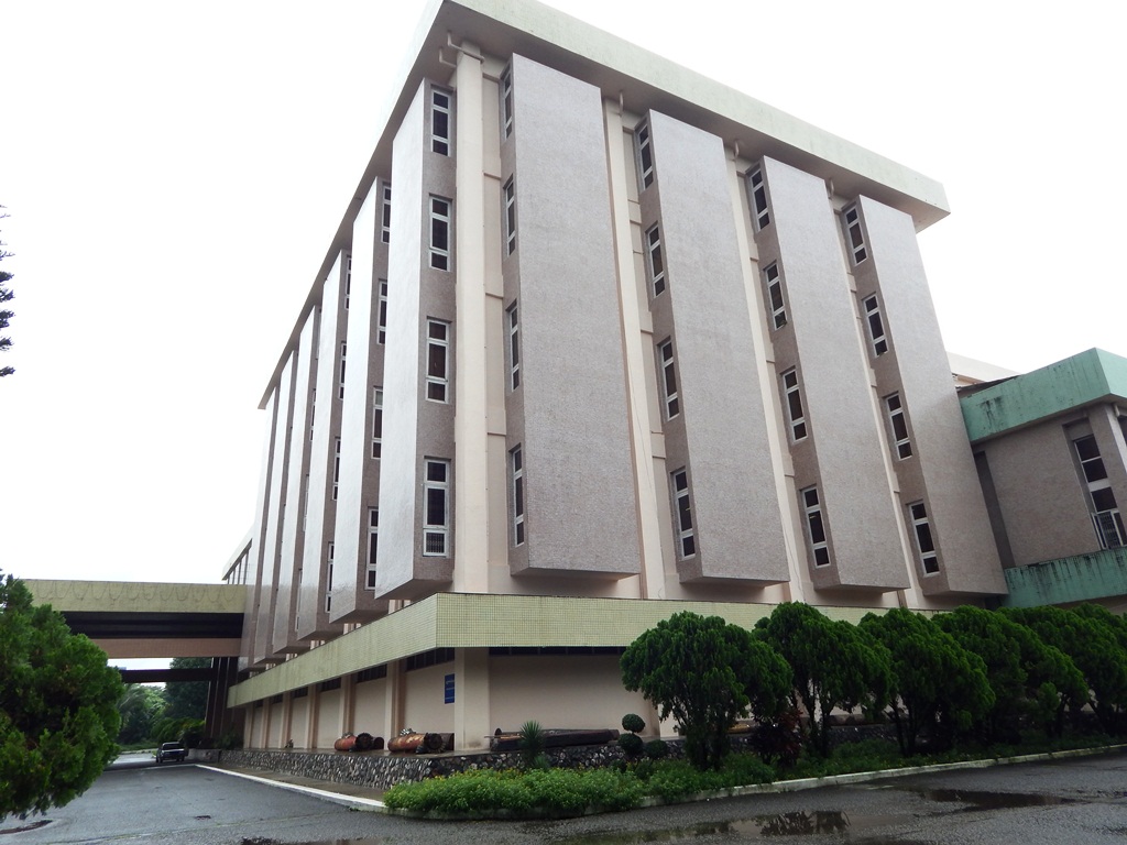 Vendors selling fresh flowers and offerings at the base of Shwedagon Pagoda stairway